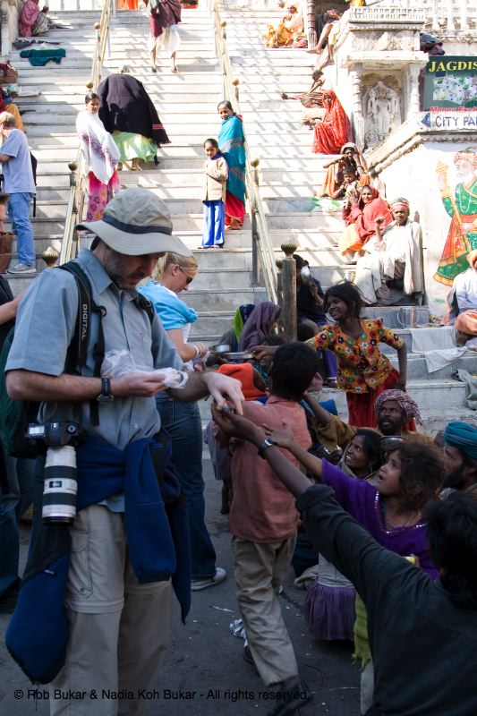Rob giving out gajak to the homeless on the holiday of Lohri, Udaipur