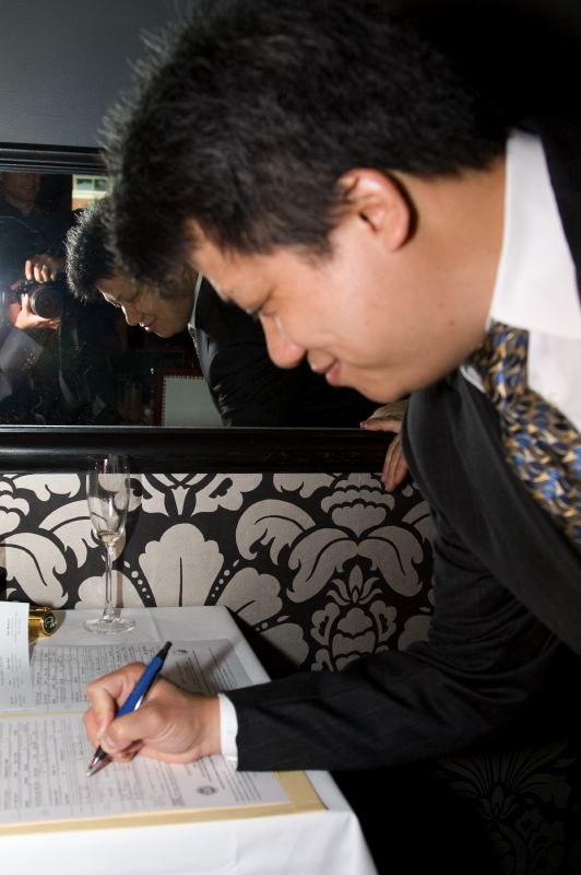 Andy Signing Wedding Contract