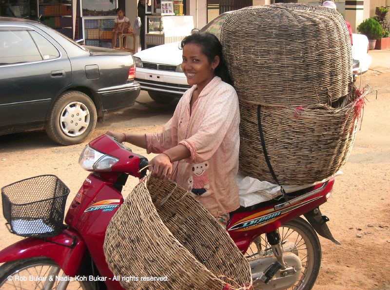 Woman on Bike, Cambodia