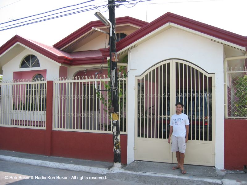 Kuya Raul in Front of House